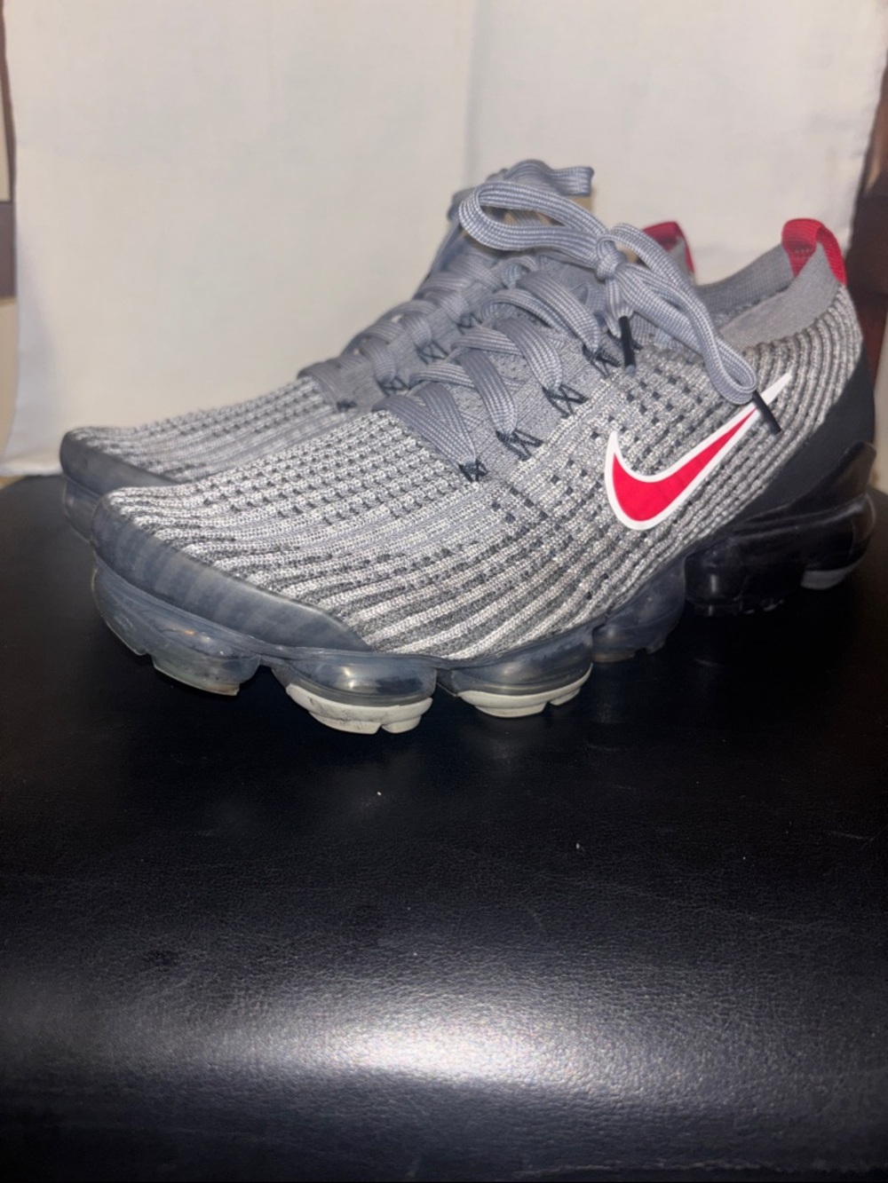 Nike Grey Flyknit Sneakers with Red Swoosh